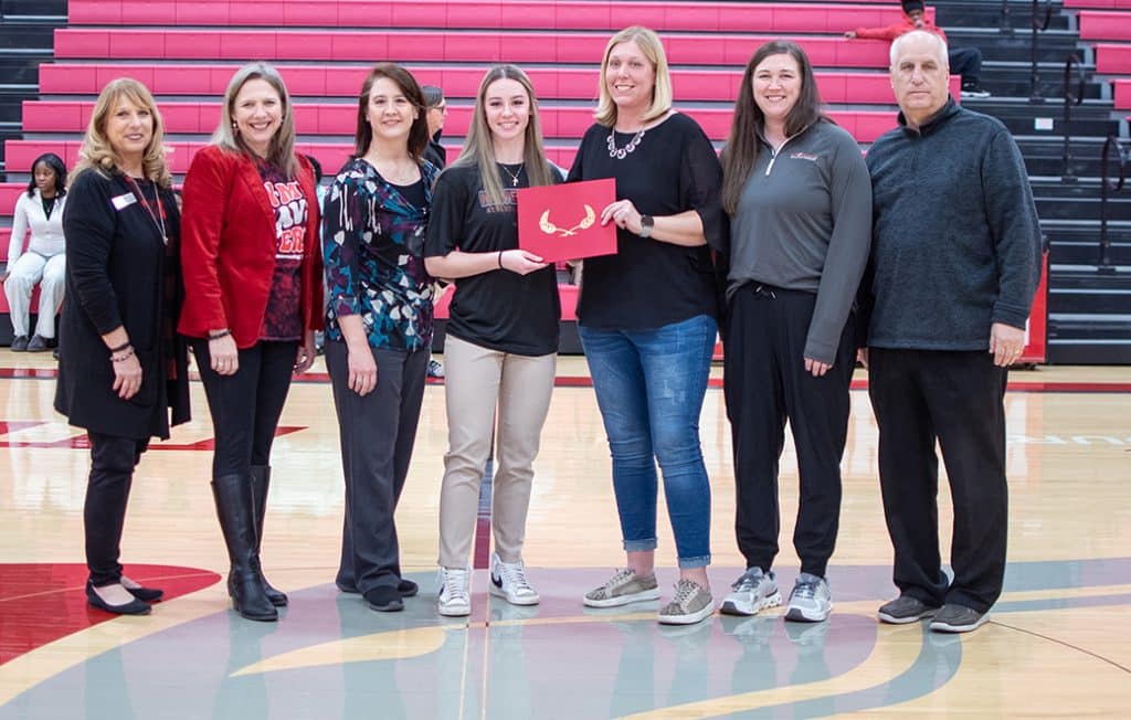 NOC student Lyndey Wilda received the Nevona Kegans Athletic Training Scholarship at Thursday’s Homecoming Basketball game against Eastern. Pictured (L-R): Director of Development and Donor Relations Candy Oller, NOC President Diana Morris Watkins, Stacy Wilda, Lyndey Wilda, HPE&R Division Chair Suzi Brown, Athletic Trainer Summer McClure, Athletic Director Alan Foster. (photo by Shiloh Martin/NOC)
